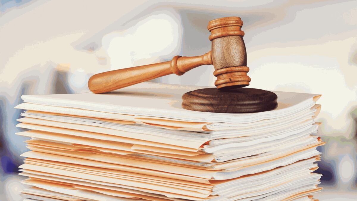 Wooden gavel on legal documents symbolizing Arizonas new criminal record sealing statute.