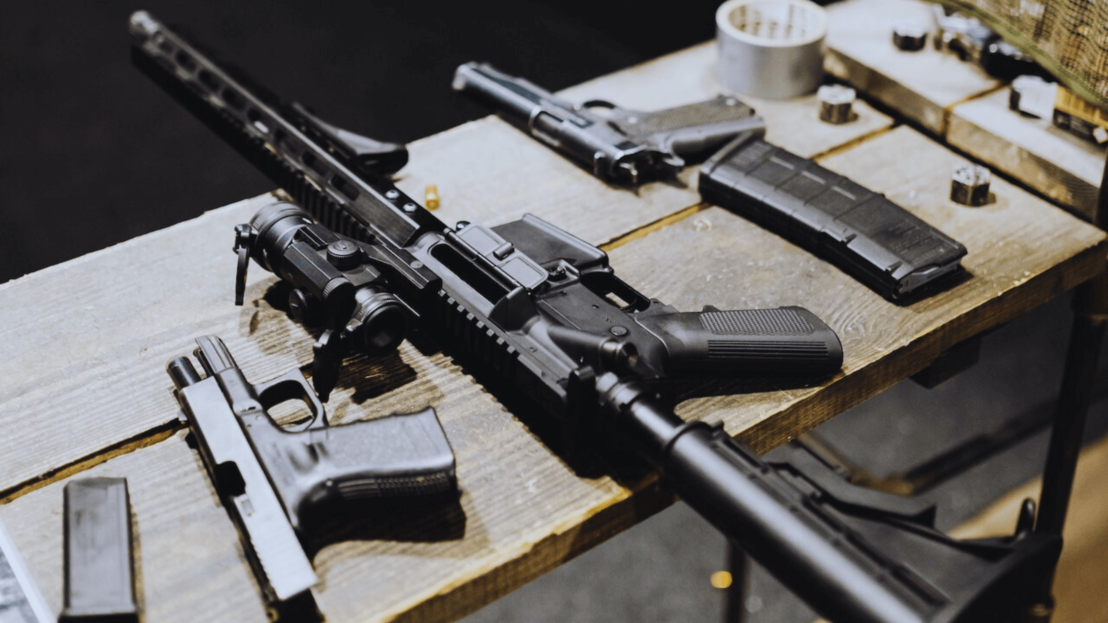 Firearm collection display showcasing various guns and rifles.