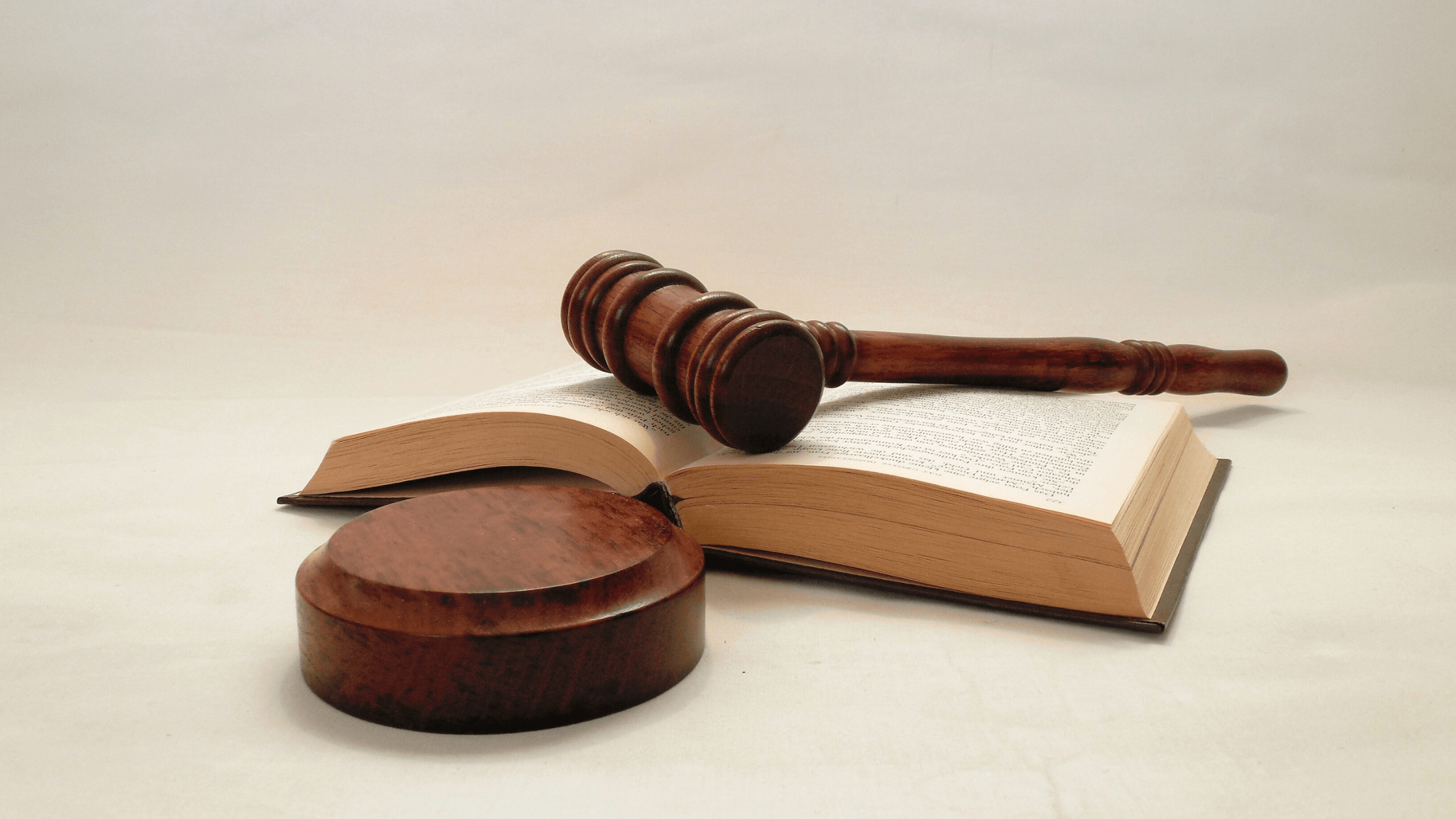 Judges gavel and law book on a desk.